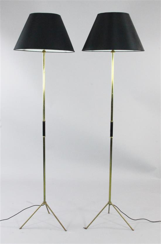 A pair of 20th century tubular brass standard lamps, H.5ft 4in. incl. shades